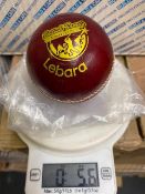 Twelve Lebara red 5.5oz cricket balls branded with British Tamile cricket league