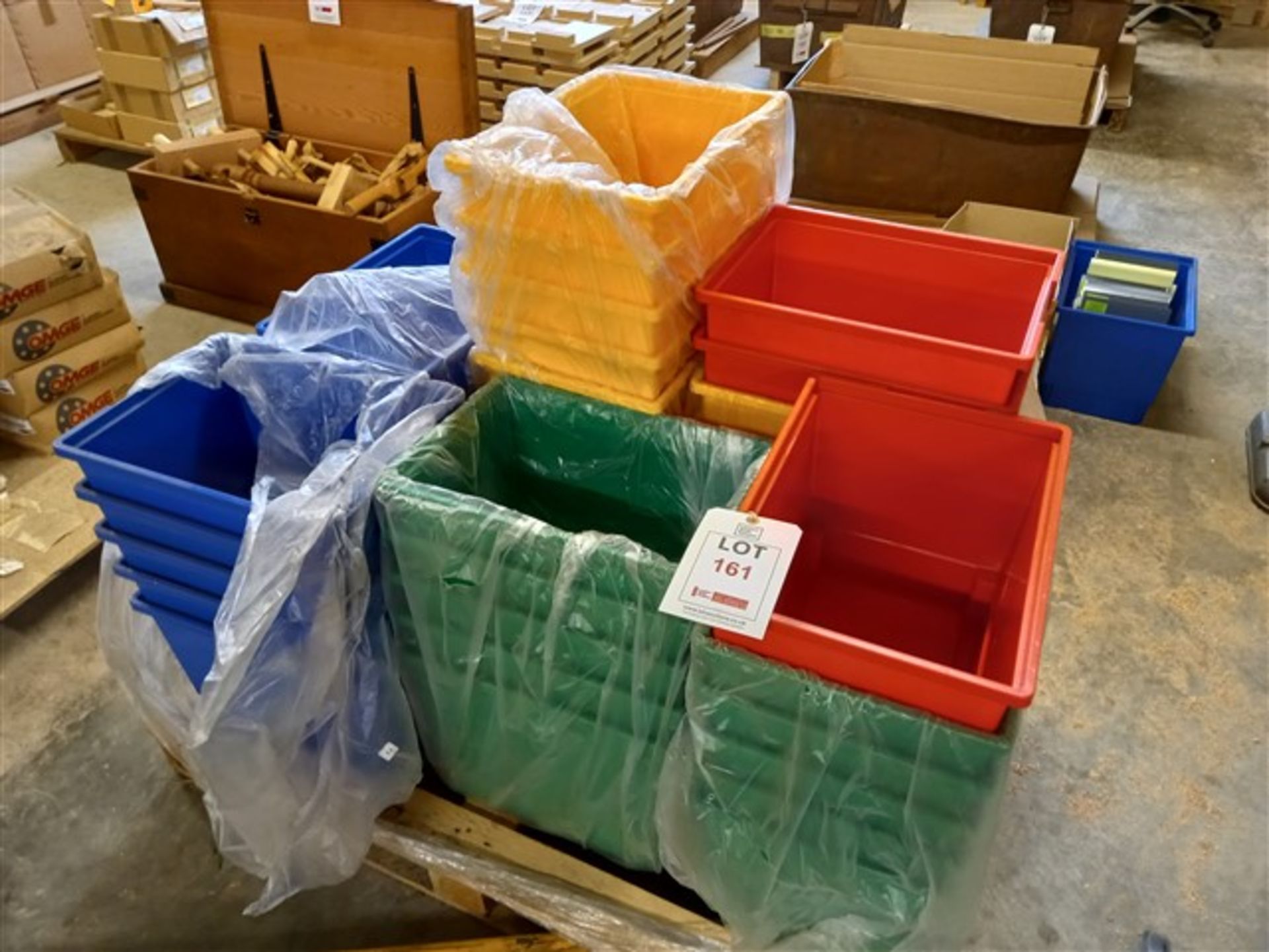 Pallet of thirty-seven coloured plastic storage crates