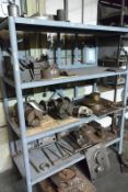 Contents of rack including 2 dividing heads, 2-3 jaw chucks, 2 angle plates, work fixtures with