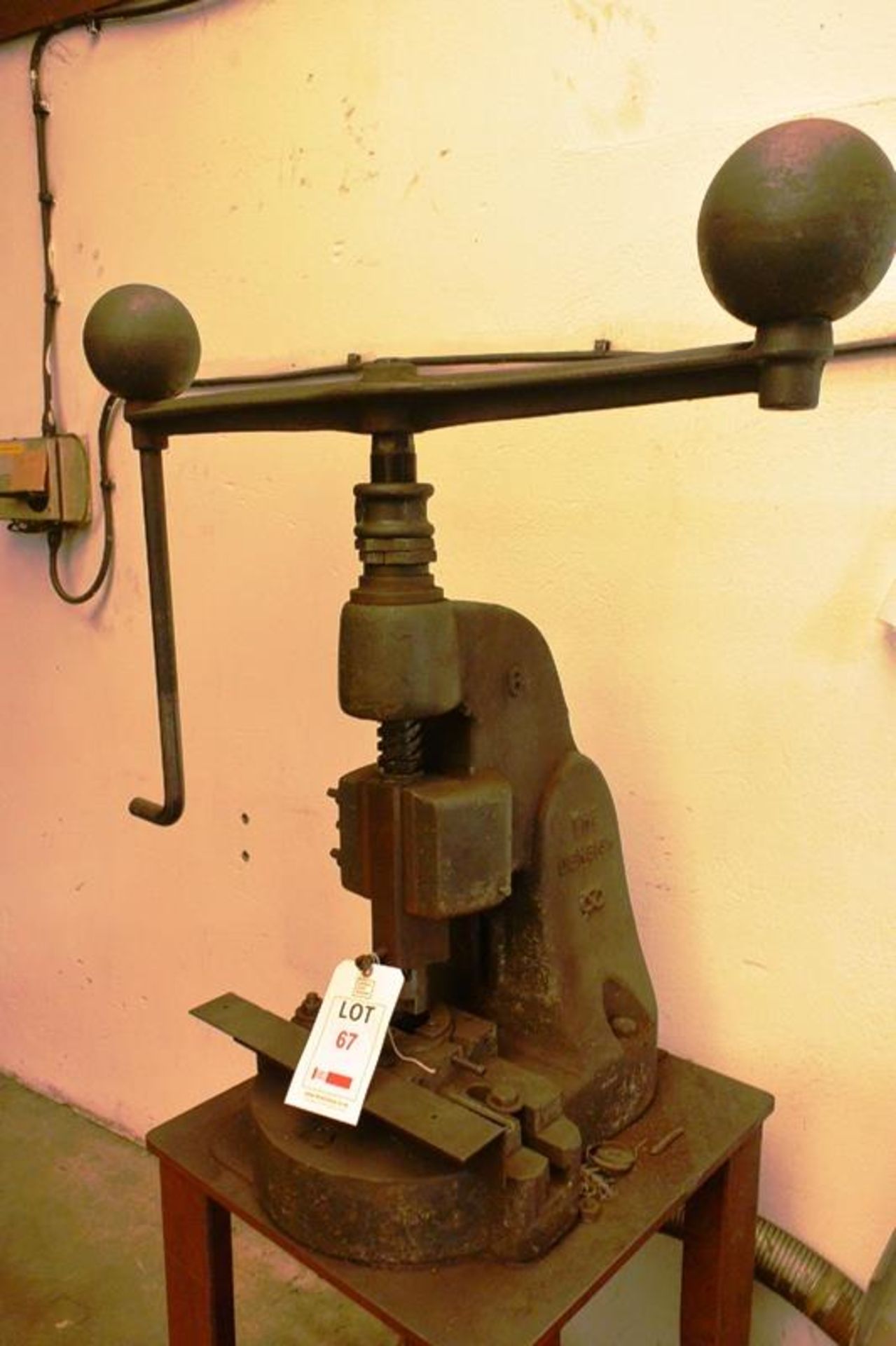 Denbigh No. 6 hand screw flypress, with handle and counter weights, mounted on bench (Recommended