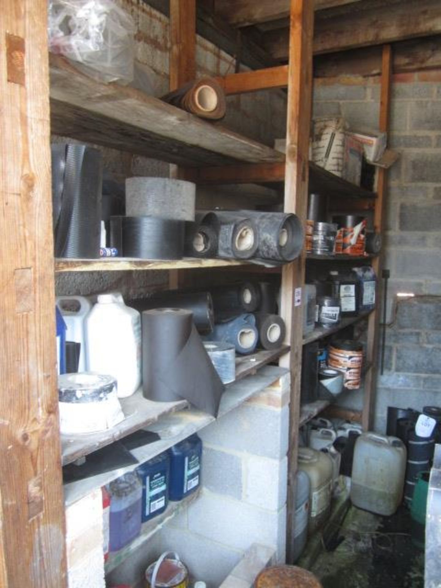 Contents of rack including assorted reels of damp proof course, sub floor Compound, adhesive seal,