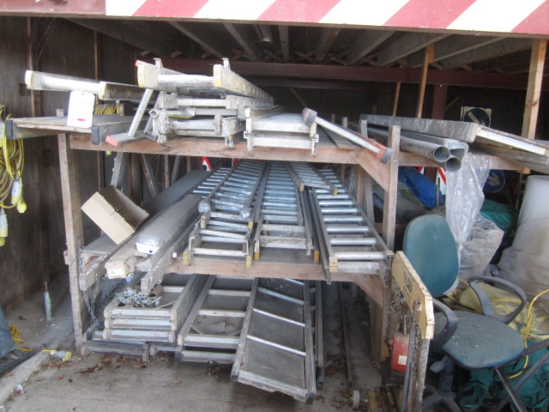 Thirteen assorted scaffold board panels and nineteen assorted ladders