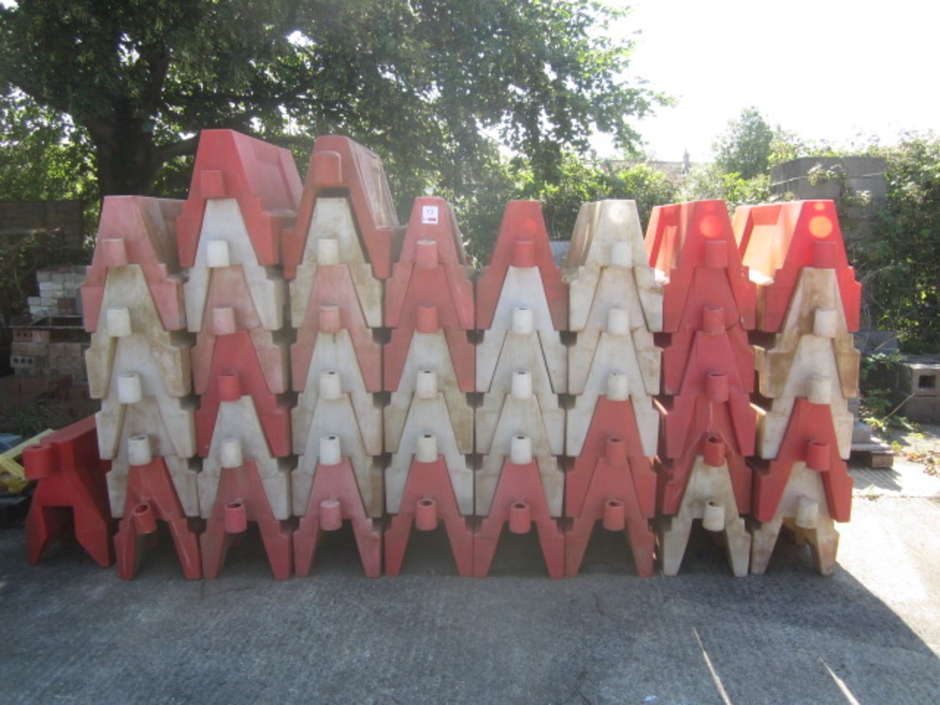 Forty three plastic orange & white barrier blocks, approx. 1000mm width - Image 2 of 3
