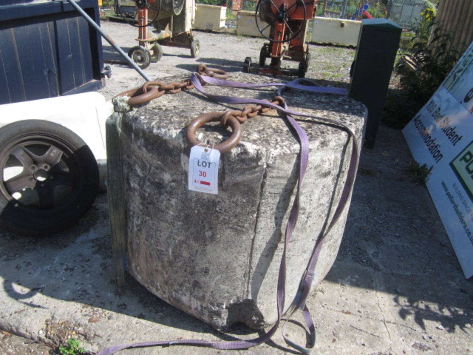 Un-named concrete weight with lifting chains. This item has no record of Thorough Examination. The