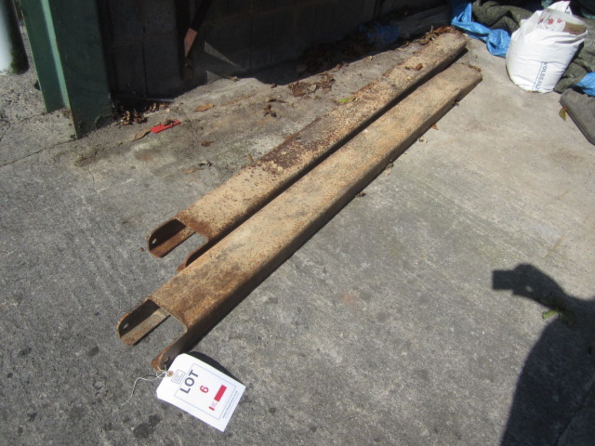 Steel set of forklift extensions, length 1900mm, width 130mm (one fork dented & damaged). This item