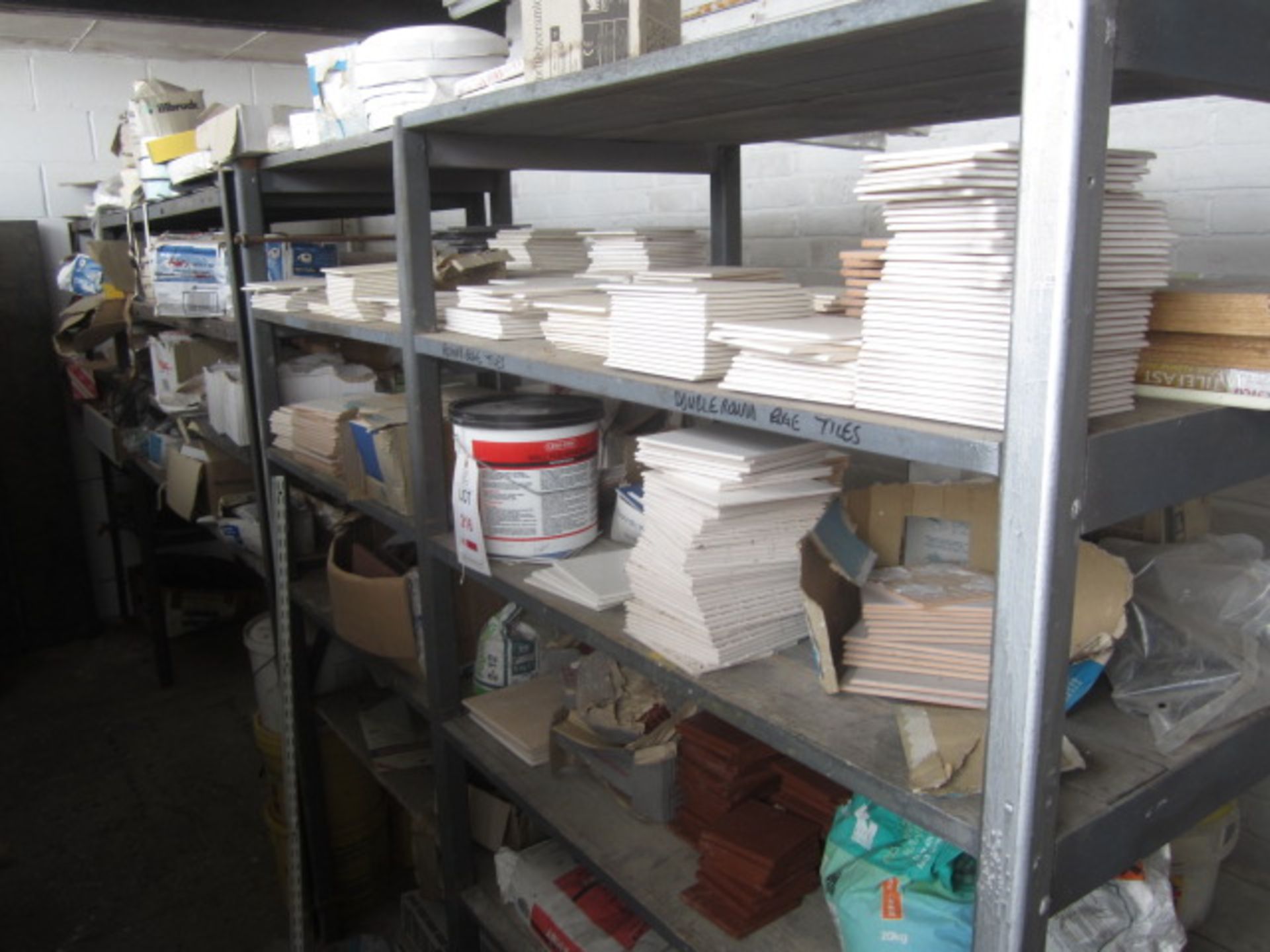 Contents of racking including assorted wall tiles, ceiling roses, flexistrip, acrylic adhesive