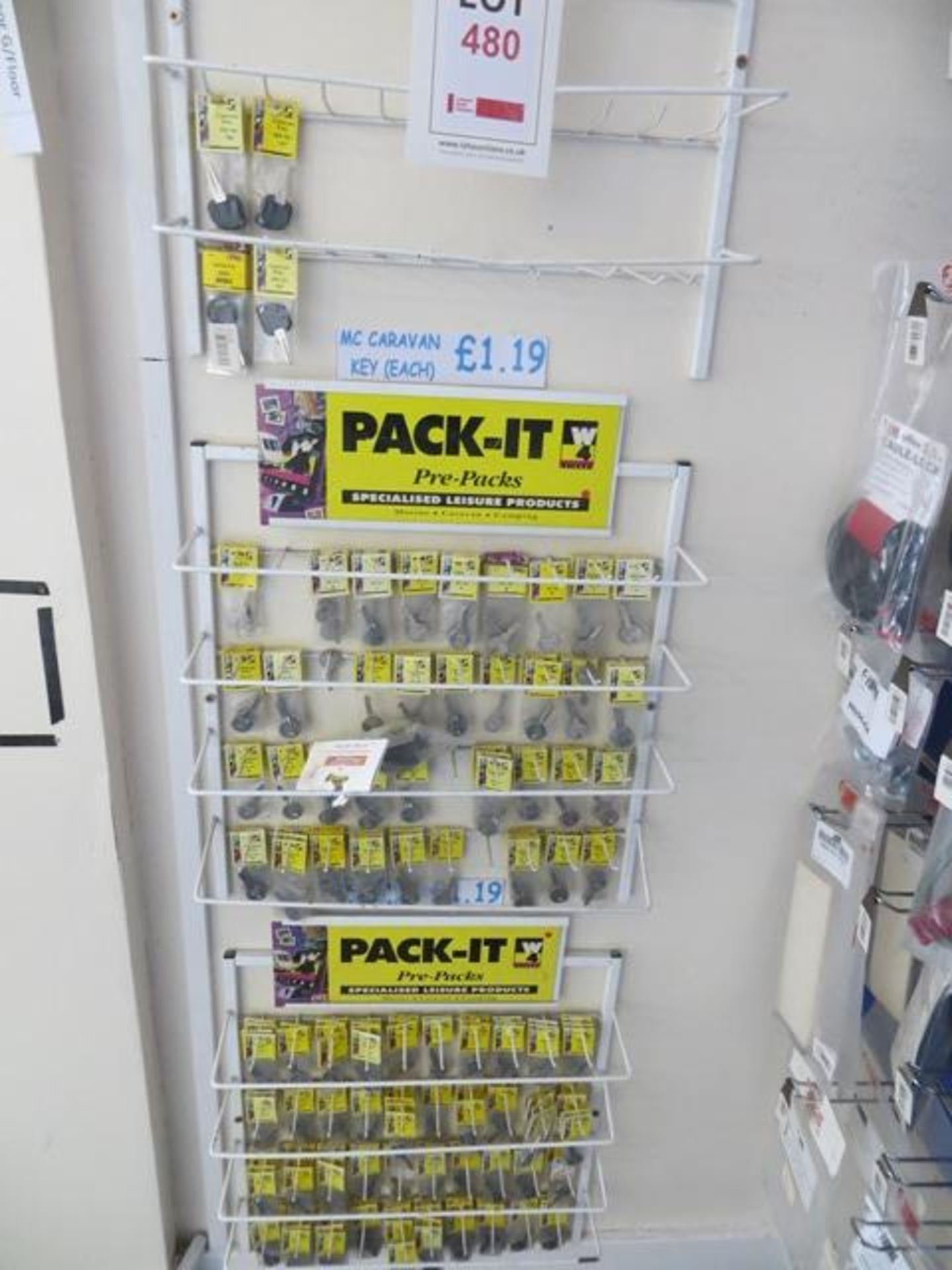 Four display racks & contents to include large quantity of Pack-it cut keys as lotted