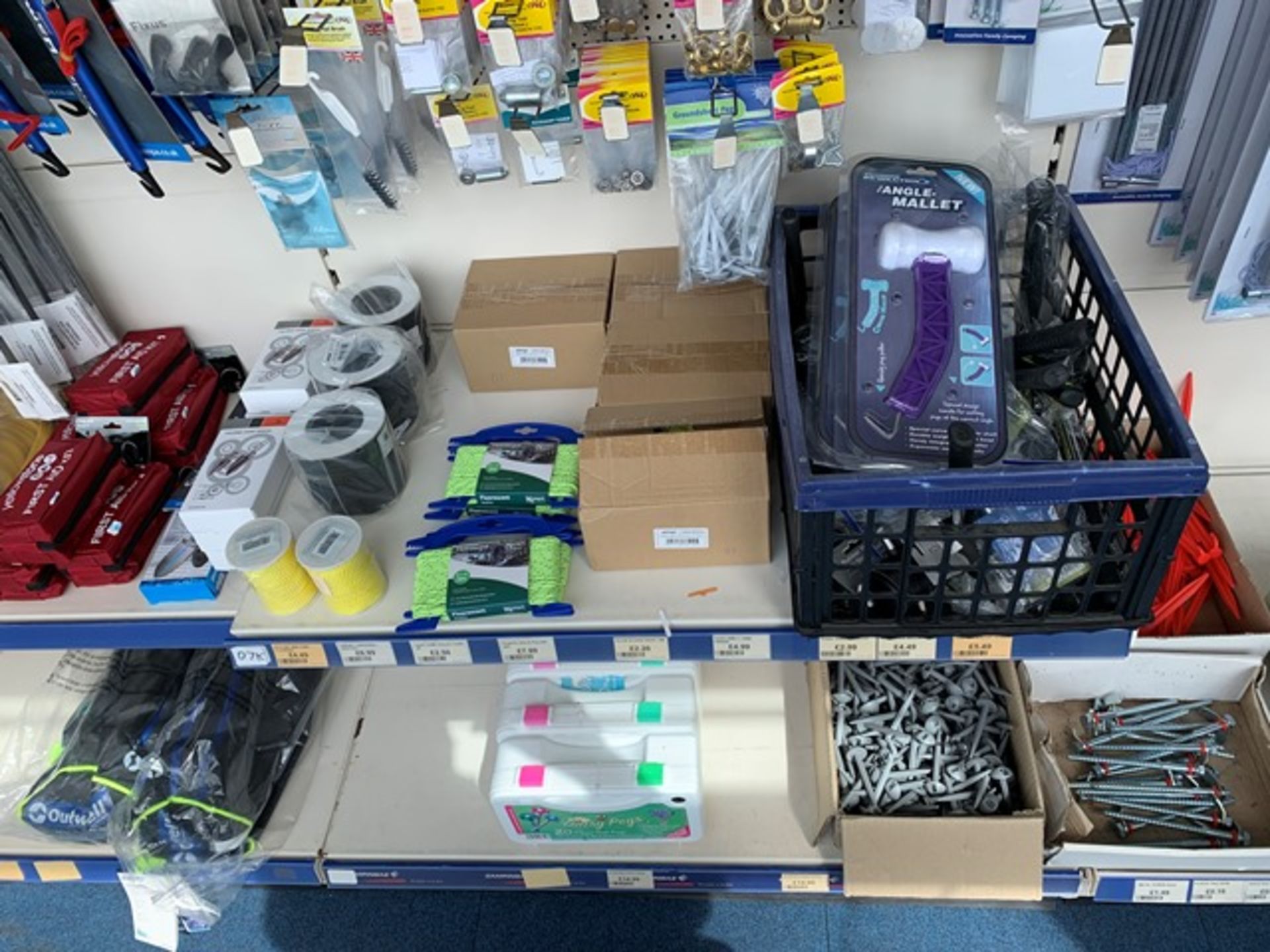 Contents of three display units to include large quantity of tent pegs, tent poles, and camping - Image 4 of 4