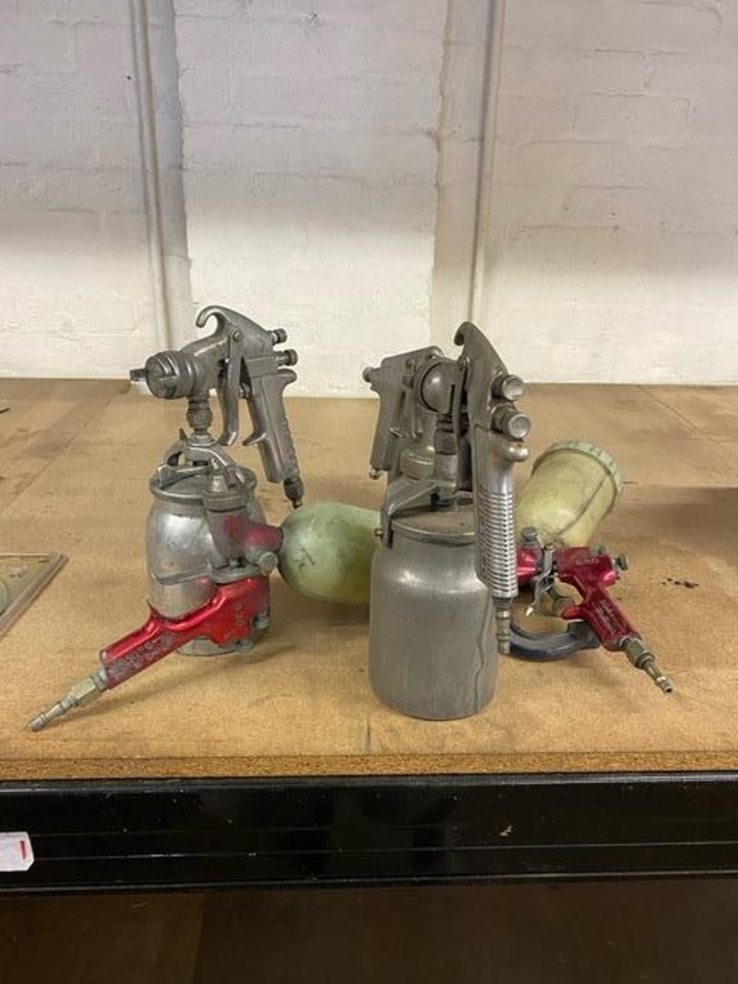 Six assorted pneumatic spray guns