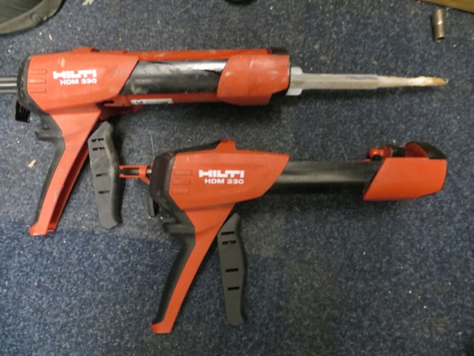 Two Hilti Glue Guns HDM330 with cases and Two Hilti Glue Guns HDM330 without cases * This lot is