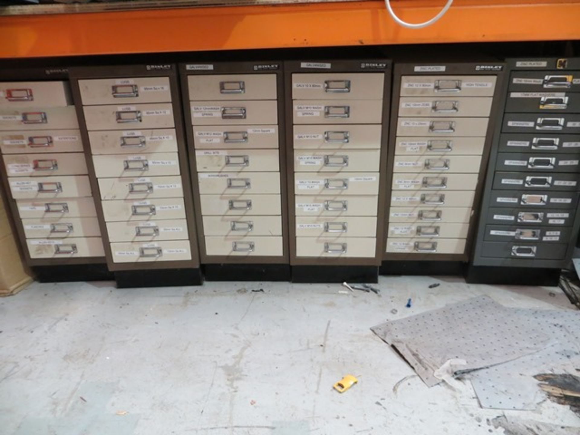 Eight steel multidrawer units and contents to include sockets, taps, punches, lugs, drill bits,