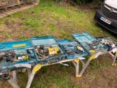 Five Makita and a Bosch electric tools