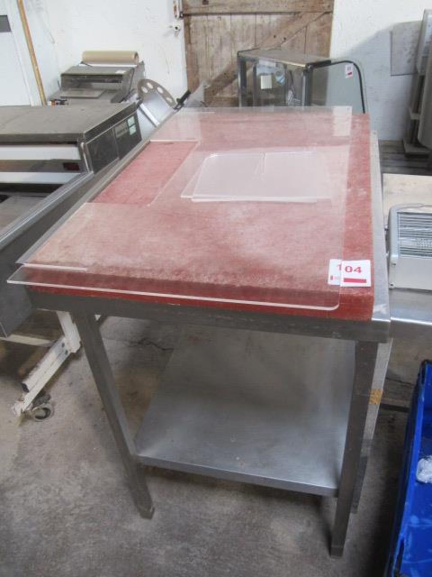 Stainless steel frame on table, with nylon cutting top, approx 900 x 650 x 900mm