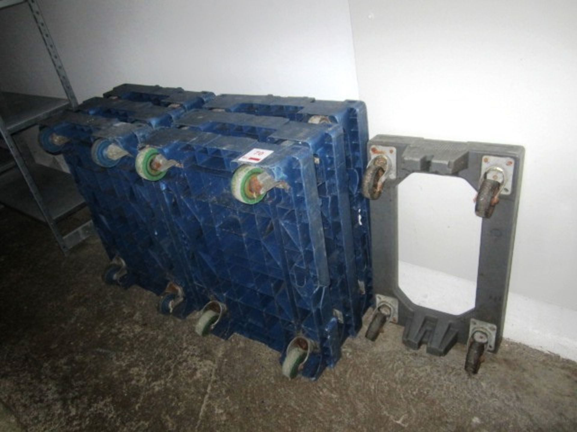 Seven various plastic mobile trollies/bogies