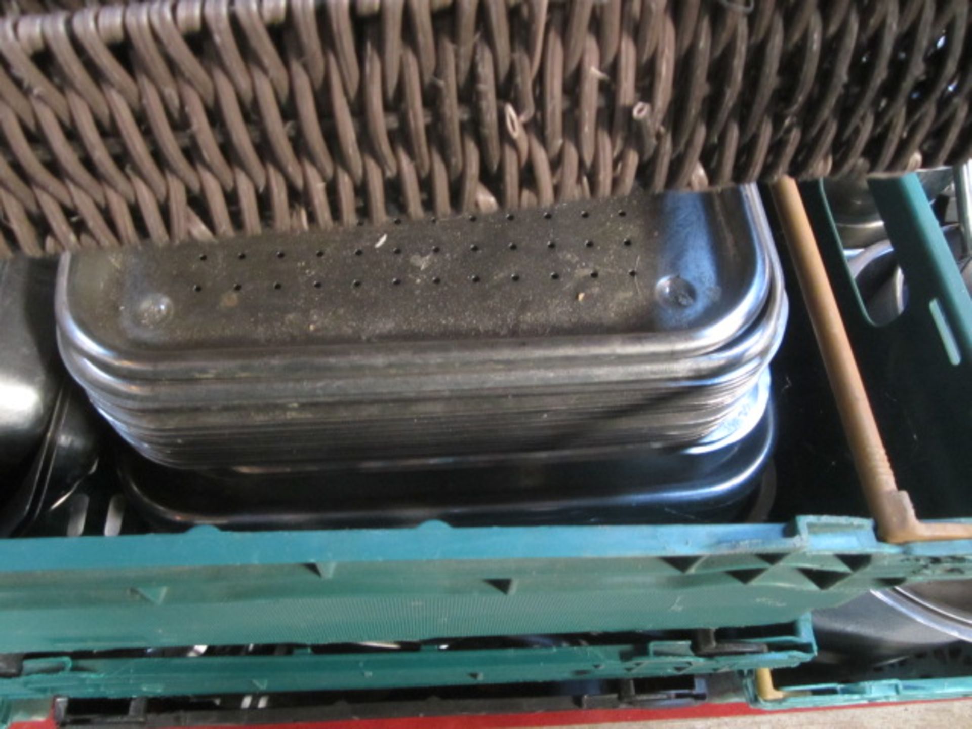 Twelve plastic crates and contents to include various pots, pans, serving trays, display baskets, - Image 7 of 10