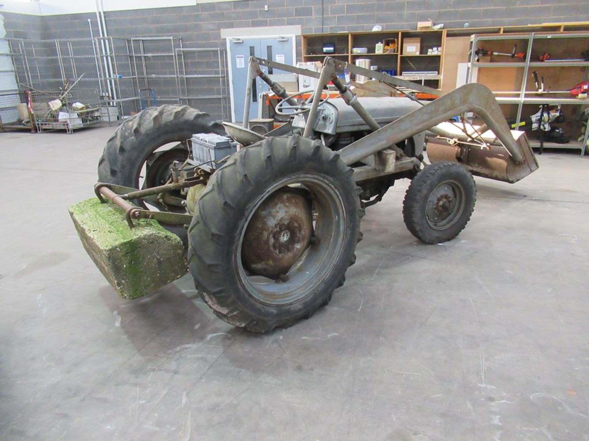 Massey Ferguson tractor with lifting attachment and counter balance