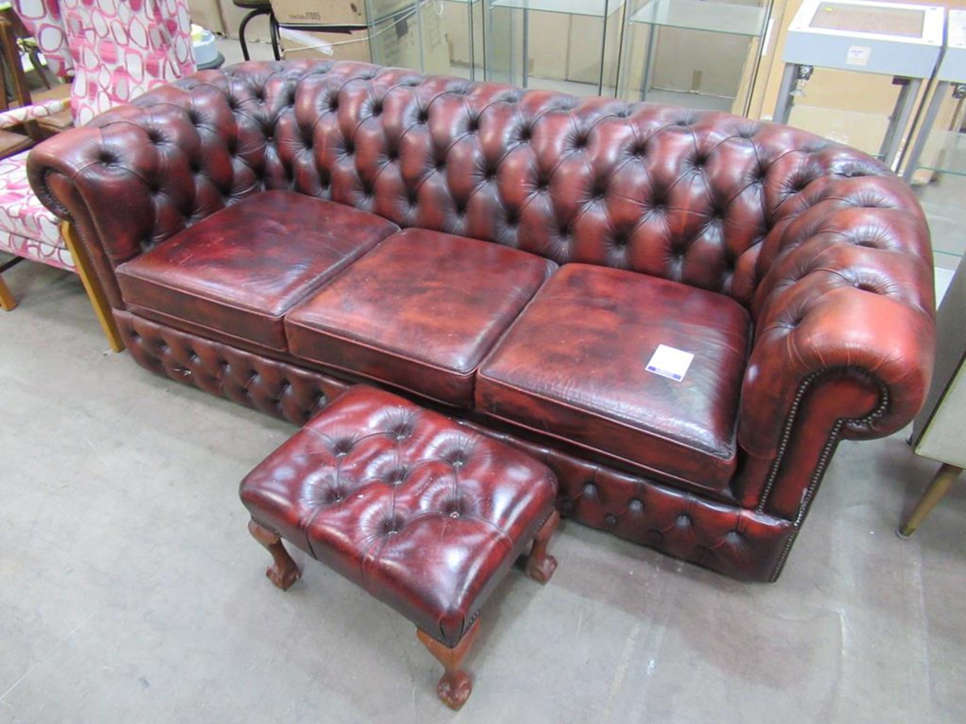 A red leather Chesterfield sofa