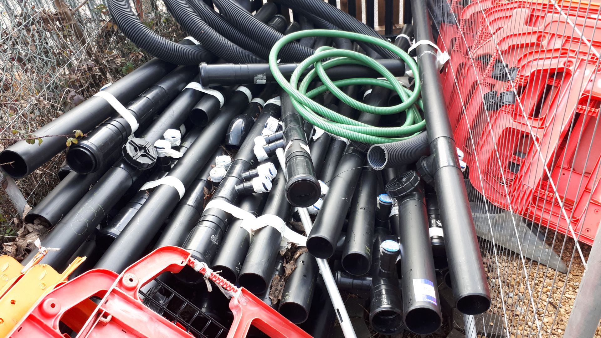 Large quantity of black plastic fall pipe, and water piping