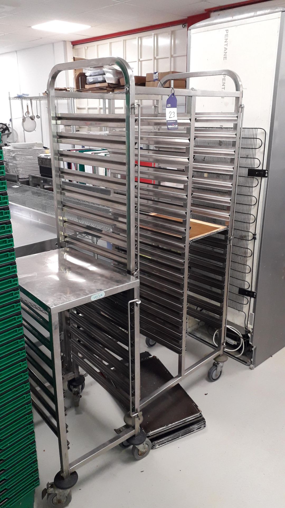 Double Column 15 Tier Mobile Tray Trolley and Vogue 7 Tier Mobile Tray Trolley and approx. 10 trays.