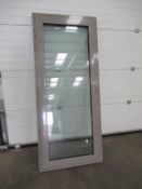 2 x Unused grey powder coated balcony doors, prehung in frames, fully safety glazed