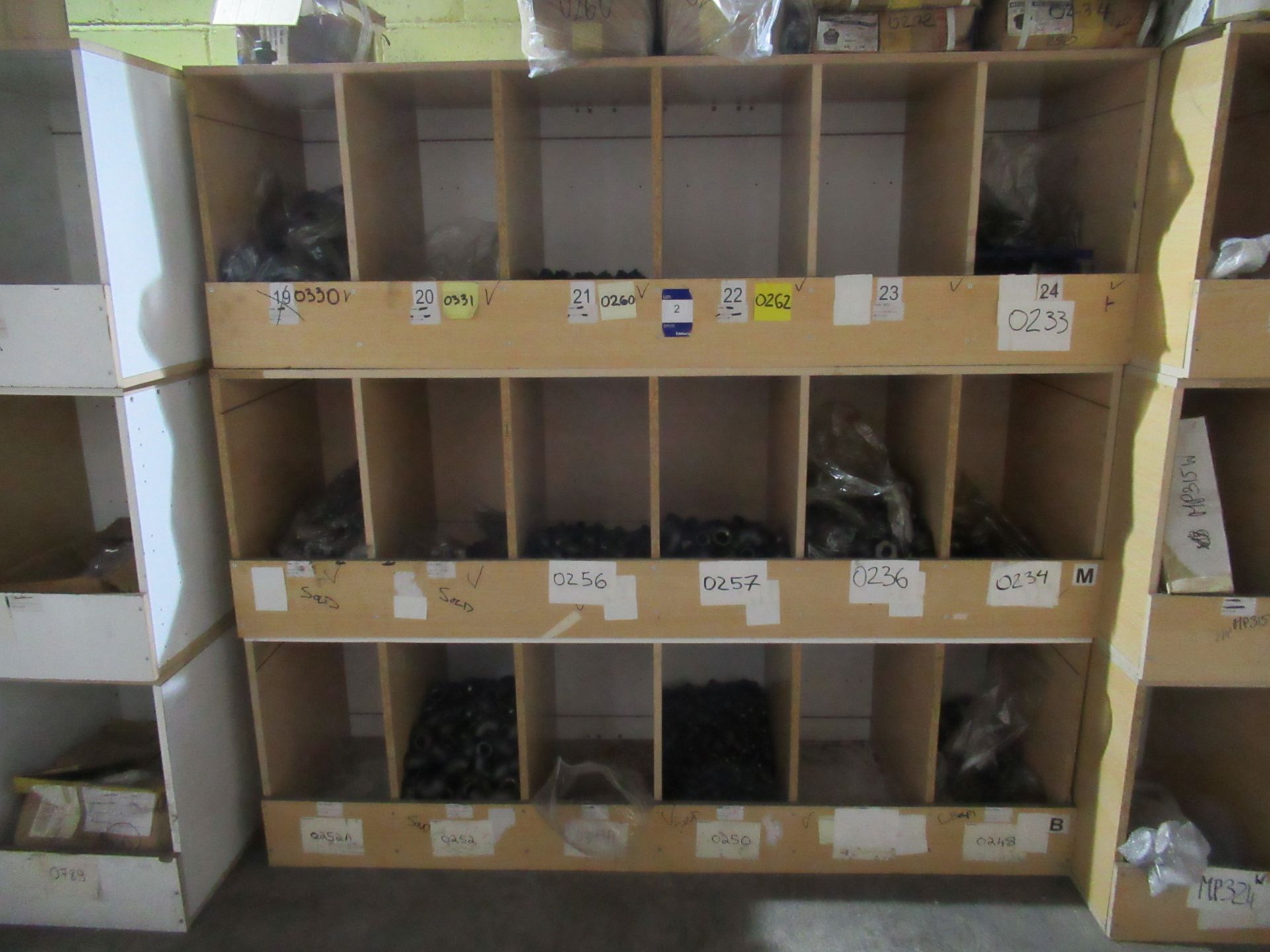 Contents to Wood Storage Unit to include Back Iron Caps, Bends, Bushes, Sockets and Various Other