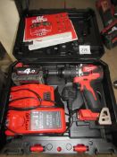 Milwaukee M18CBLPD cordless drill with charger in case