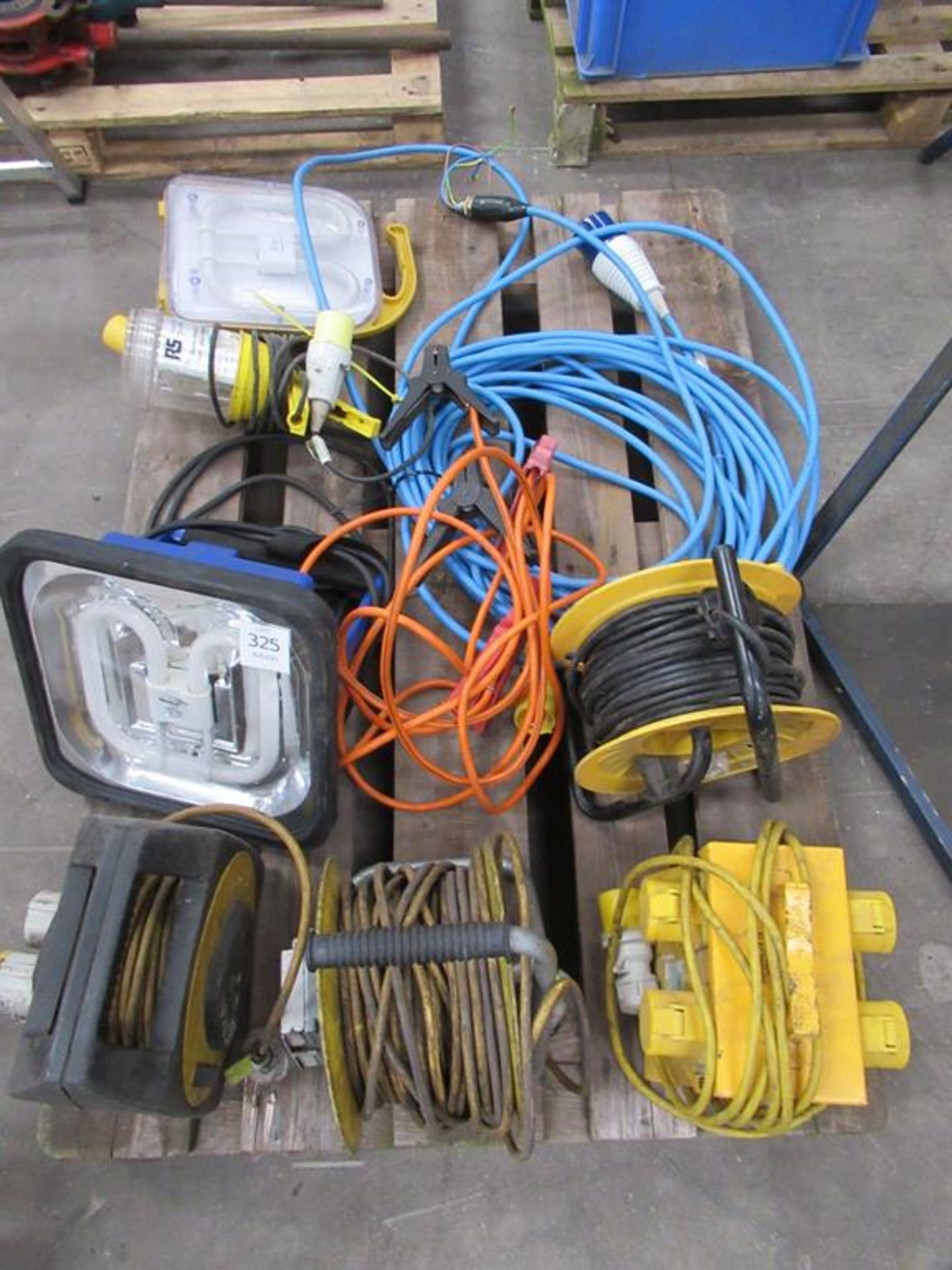 Contents of a Pallet including 3 110 Volt Extensions, 110 Volt Splitters, Various Lights etc