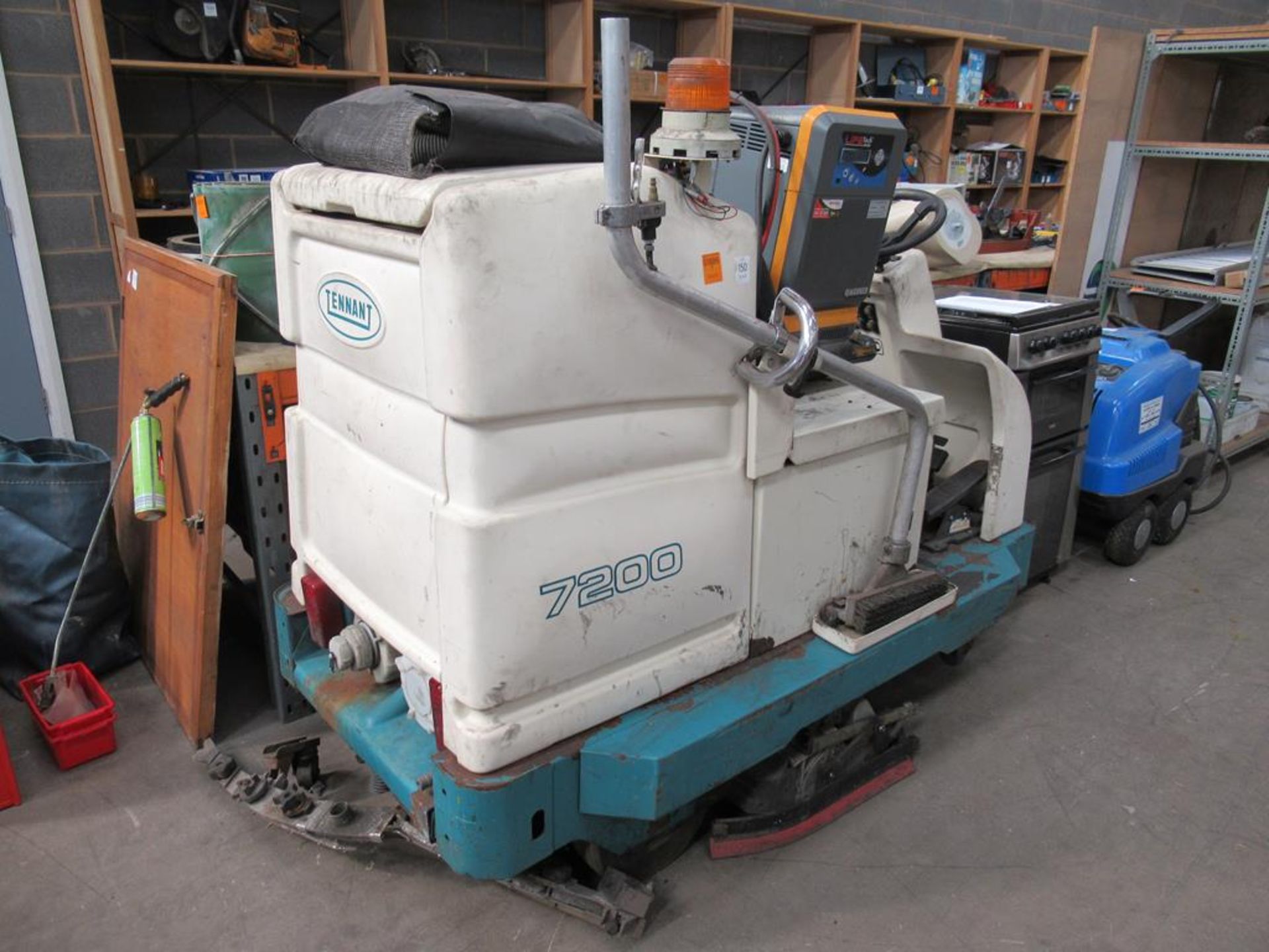 A Tennant 7200 ride on scrubber dryer