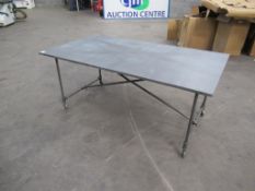 Metal dining table on wheels