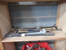 Quantity of various hand tooling on shelf to include 'Crow' bars, cramping wrenches etc. along with