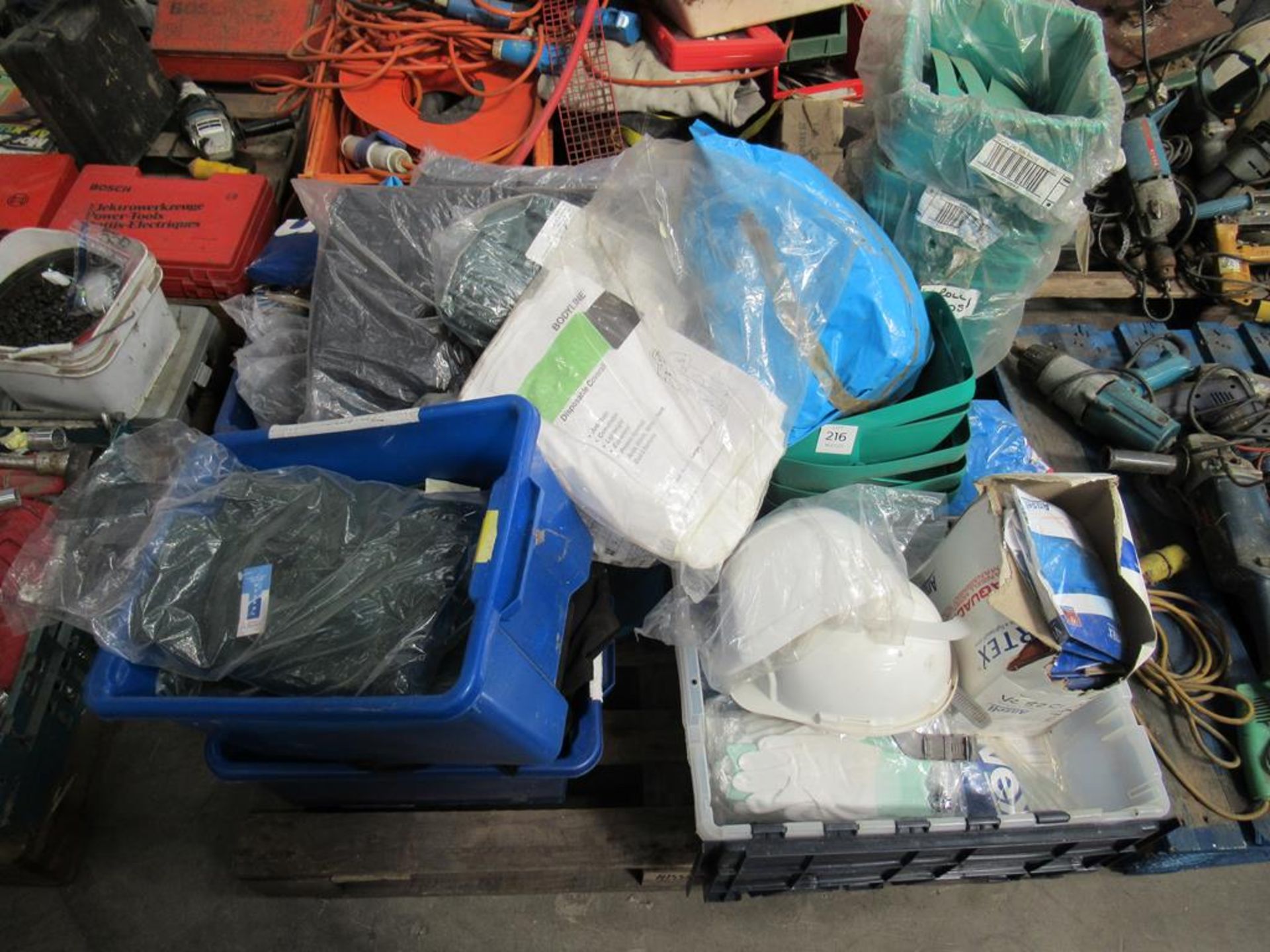 Pallet of PPE including hard hats, coverals, sweatshirts, gloves etc.