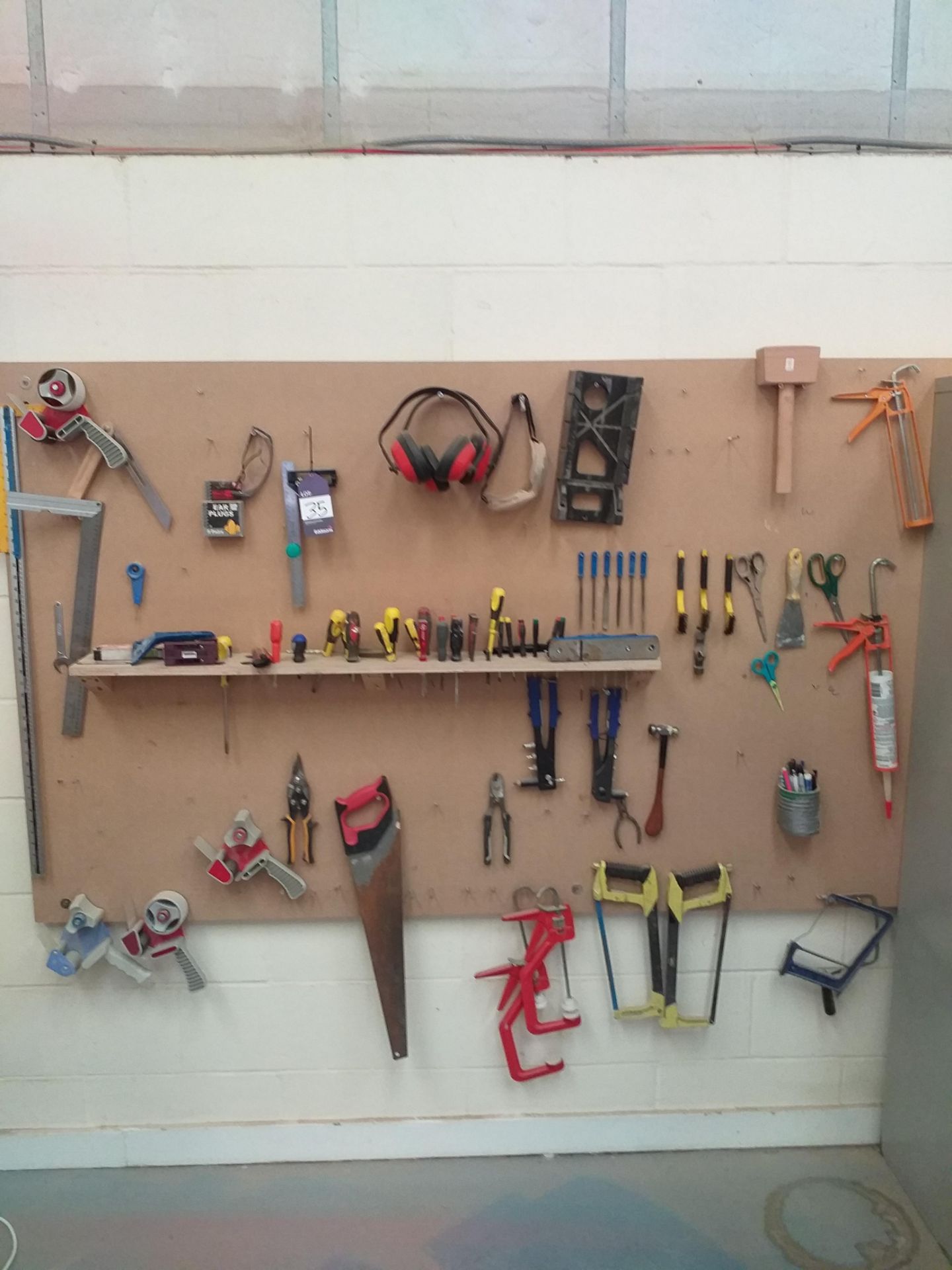 Quantity of Hand tools on Wall Board