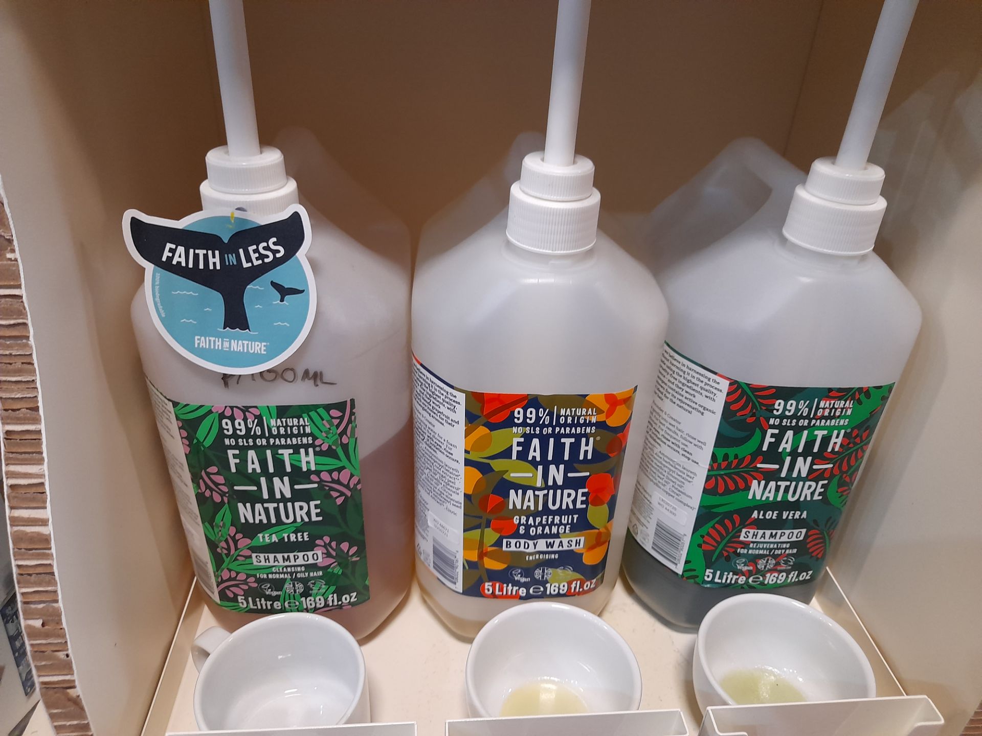 2x Faith in Nature Display Stands with 19x part opened Faith in Nature shampoos, conditioners, - Image 7 of 7