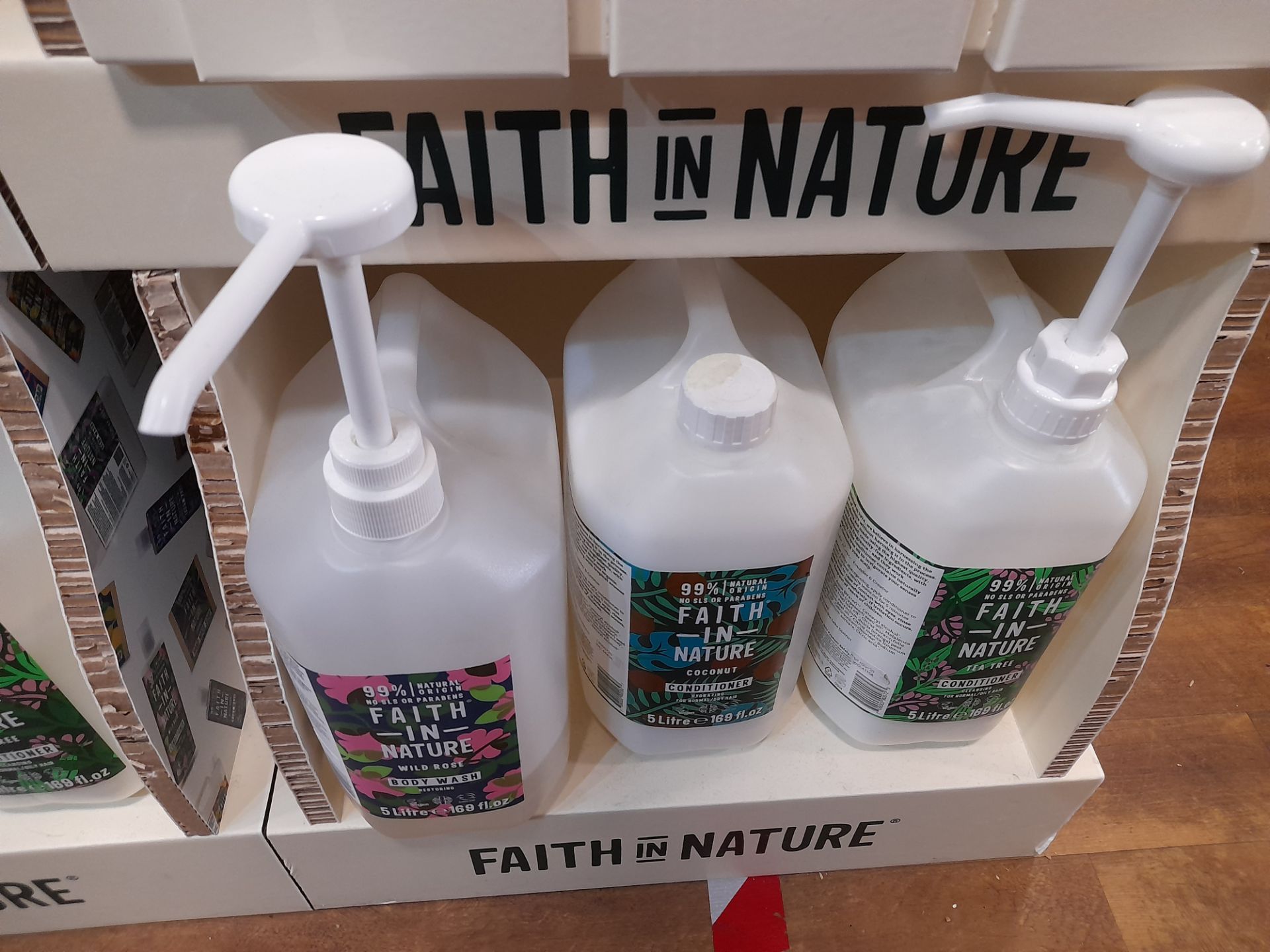 2x Faith in Nature Display Stands with 19x part opened Faith in Nature shampoos, conditioners, - Image 6 of 7