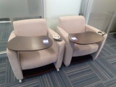 Pair of executive armchairs, oatmeal, with table section and drinks holder. Location – London.