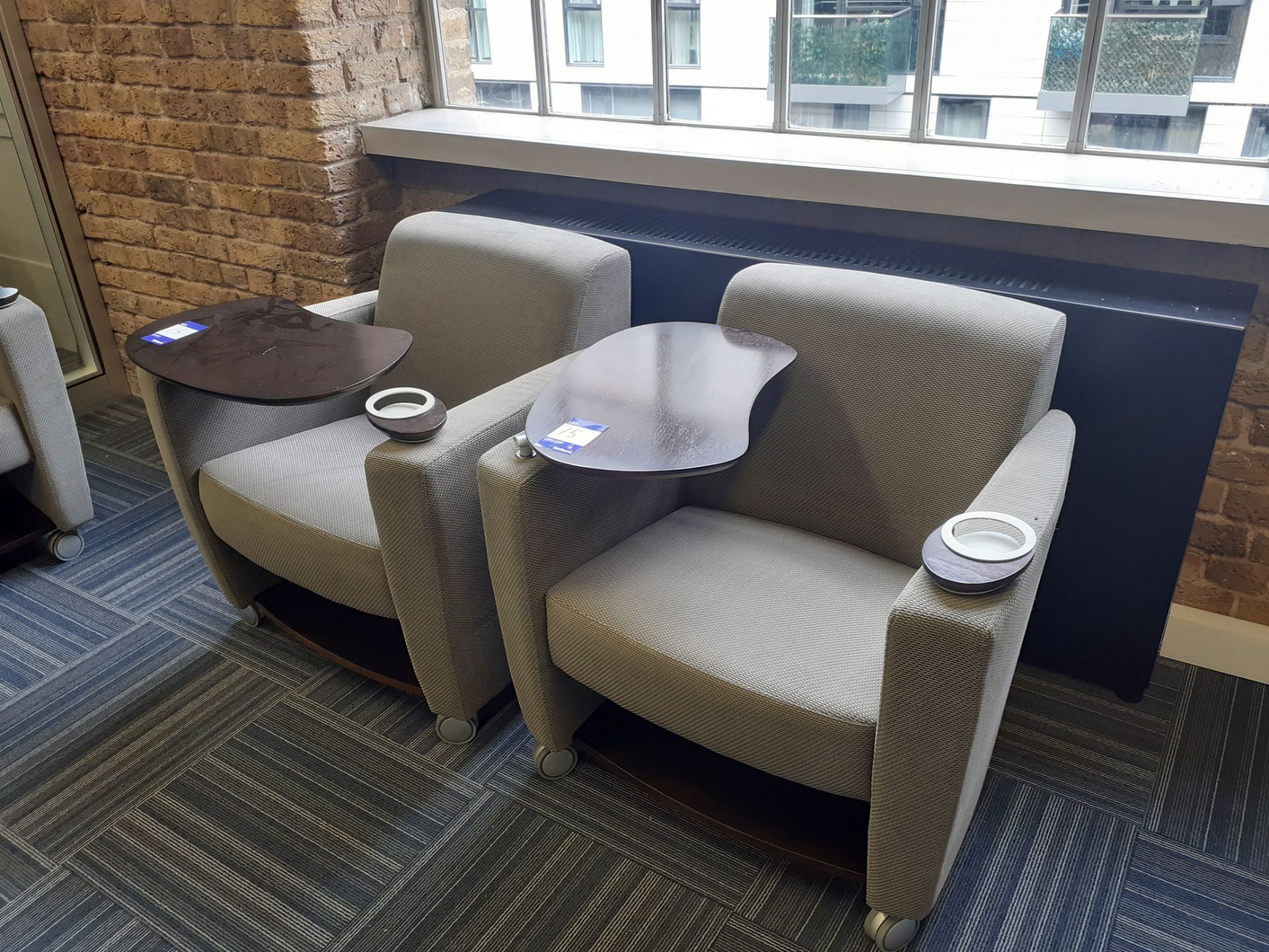 Pair of executive armchairs, slate, with table section and drinks holder. Location – London. Viewing