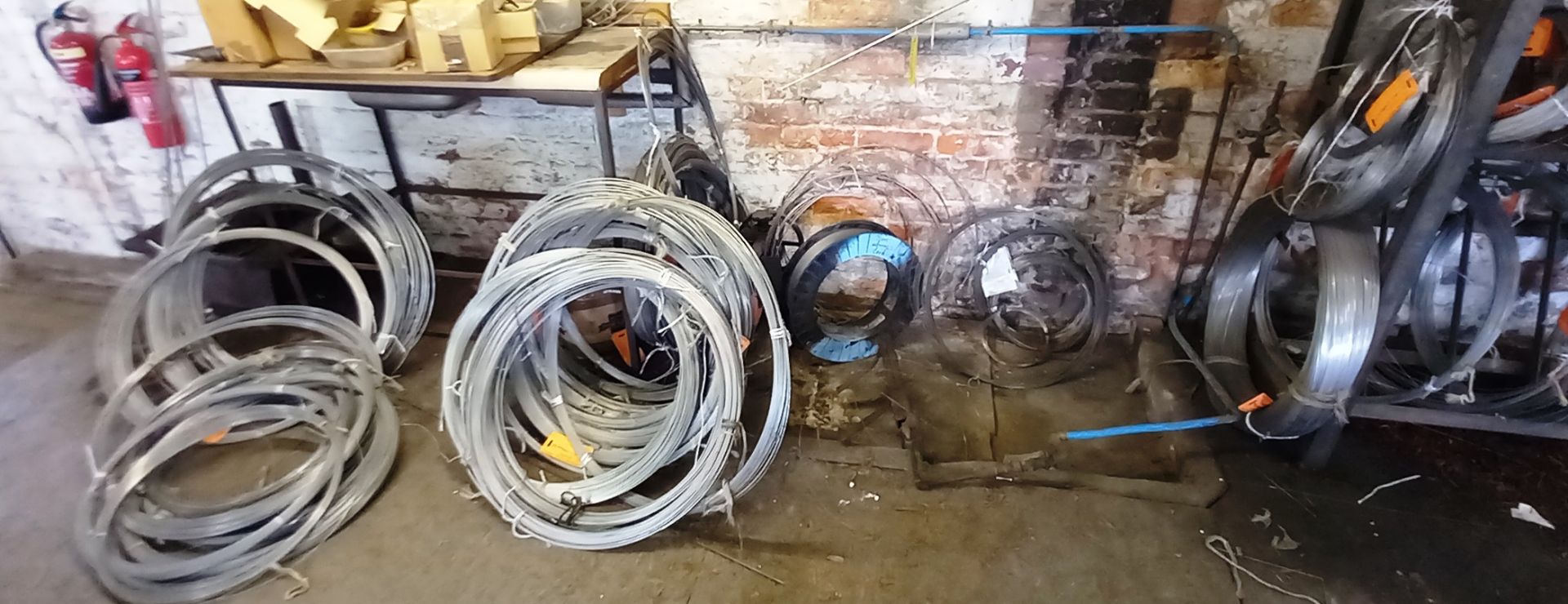 Large Quantity of Various Stainless Steel Wire Stock to Rack and Wall - Image 2 of 7