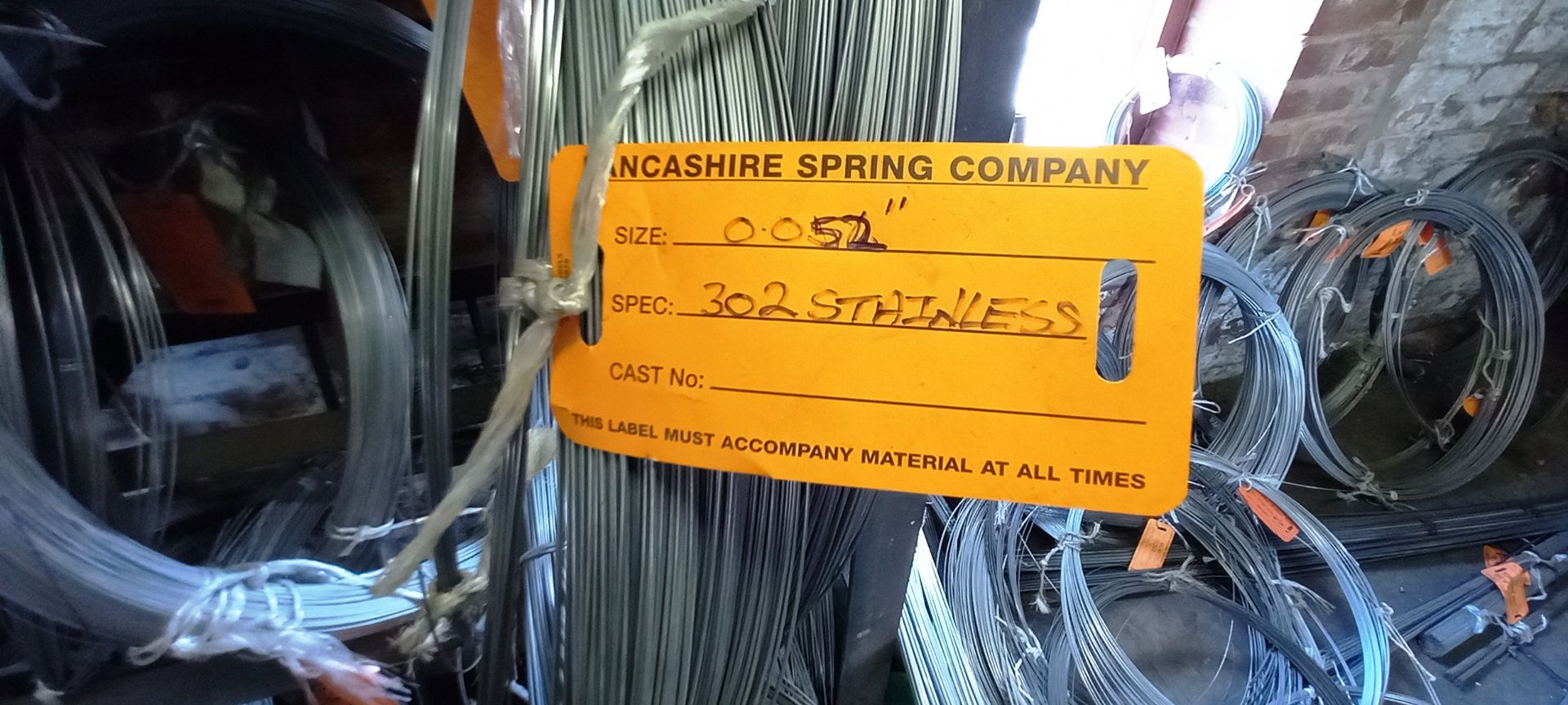 Large Quantity of Various Stainless Steel Wire Stock to Rack and Wall - Image 5 of 7