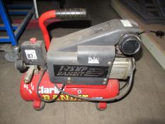 Clarke Bandit 1.25 HP mini air compressor along with 2 metal vehicle ramps