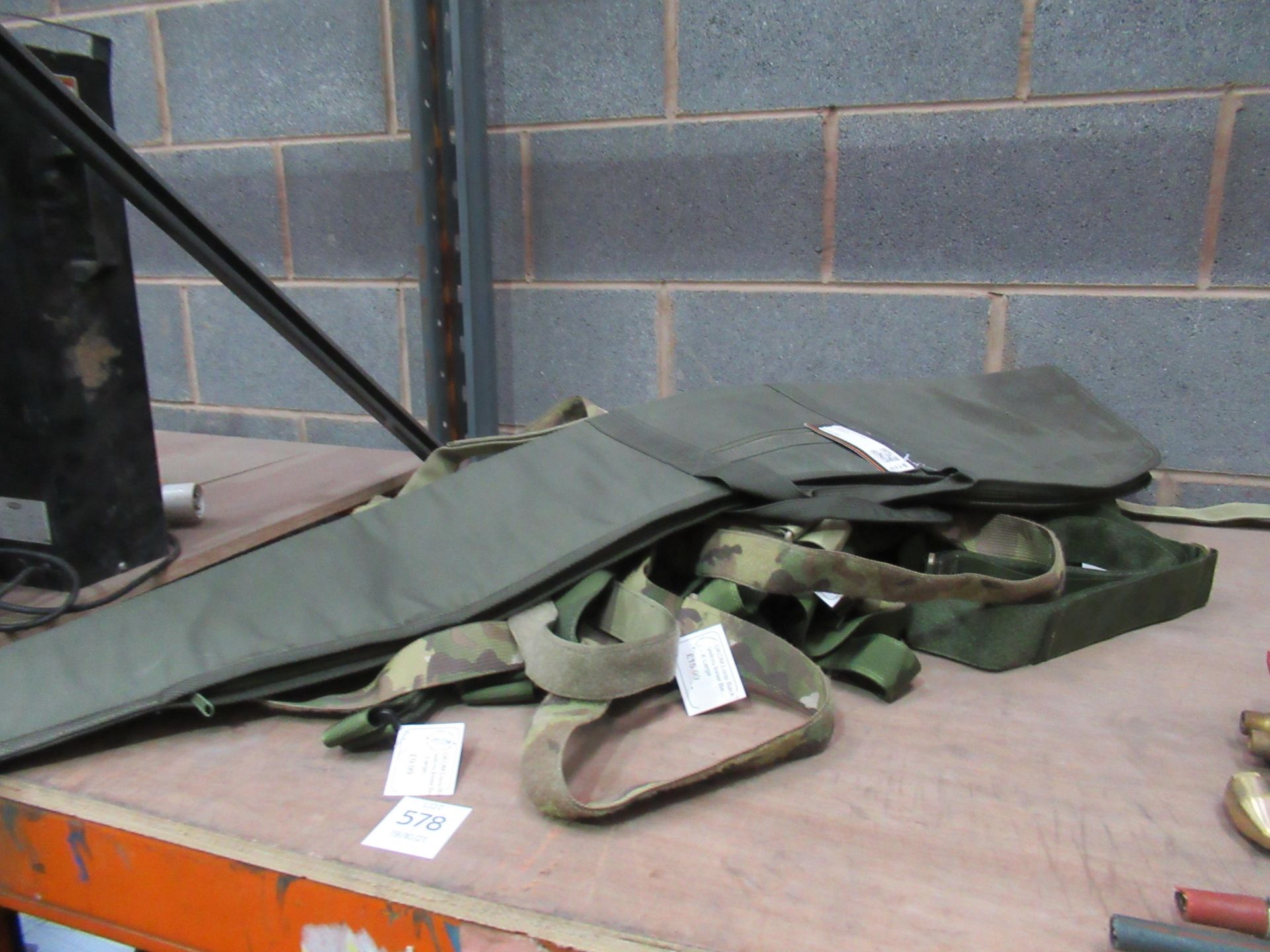 A qty of loop back military style velcro belts and a hunter gun bag