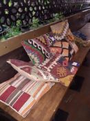 7 x Arabic Carpet Cushions & 2 Small Rugs, Located at 14 Leicester Square, London WC2H 7NG