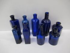 Box of Cobalt blue glass bottles including 'Not To Be Taken' bottles, Hyde London ink bottle etc.