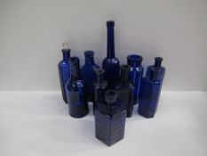 Box of Cobolt blue glass bottles including 'Not To Be Taken' bottles