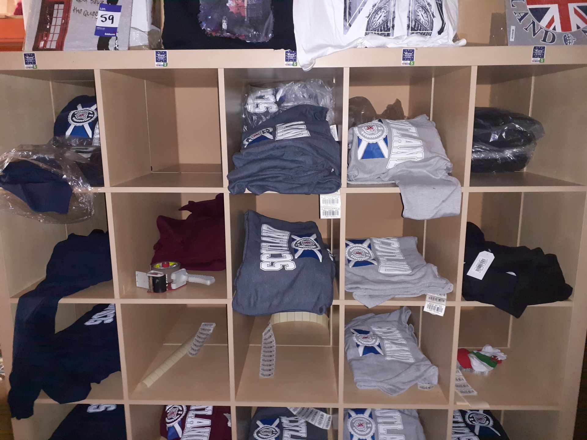 Two Shelving Units & Contents of Mainly Scottish Themed Hooded Sweat Shirts