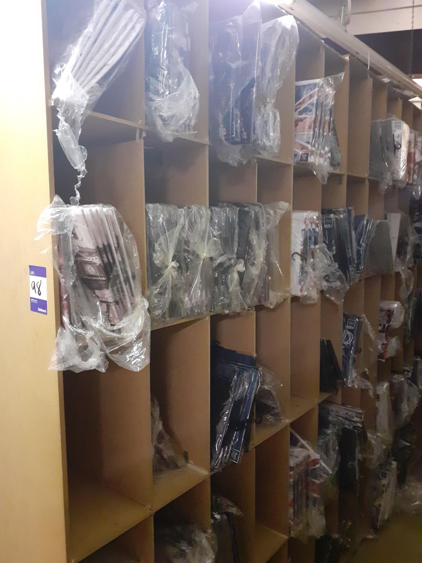 Large Quantity of Tourist Themed T-Shirts to shelving