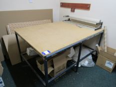 Laying out table and packer paper roll dispenser