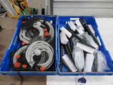 a box of brush attachments and a box of reinforced hoses