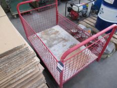 A Red Caged Porters Trolley