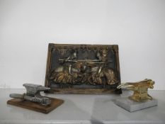 Two Desk Model Nutcrackers in the form of Anvils & Cast Resin Plaque Scene of Jousting Knights (33cm