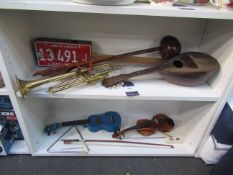 Two Shelves of Musical Instruments including Hohner Harmonica, Mandolin etc